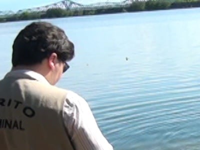 Perito durante a retirada do corpo de Sérgio do Rio Paraná -