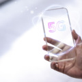 5G global network background technology with futuristic transparent smartphone remixed media